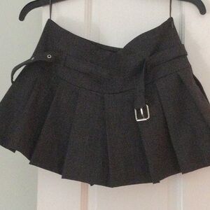 Pleated Black Mini Skirt with Buckle Detail